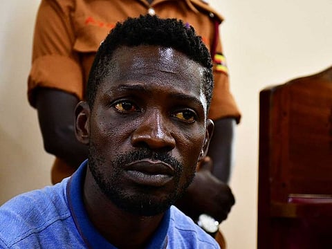 Ugandan presidential candidate Robert Kyagulanyi also known as Bobi Wine sits inside the courtroom in Iganga, eastern Uganda November 20, 2020. 