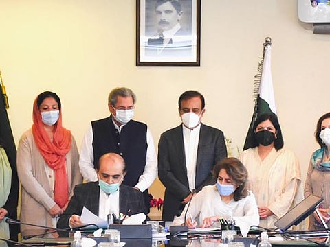 Federal Minister for Education Shafqat Mahmood Federal Minister for Information Senator Shibli Faraz Secretary Education Farah Hamid Khan at the signing ceremony.