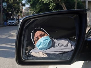 Mother-of-five steers new course as Gaza's first woman taxi driver
