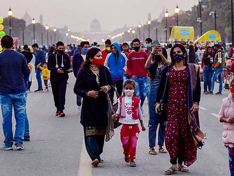 People visit the India Gate at Rajpath, amid the ongoing coronavirus pandemic, in New Delhi, Sunday, Nov. 22, 2020. 