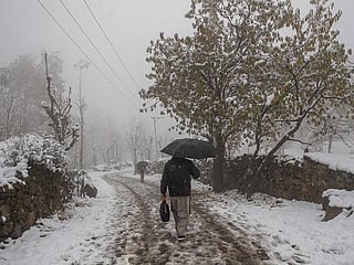 Photos: Season's first snowfall covers Kashmir
