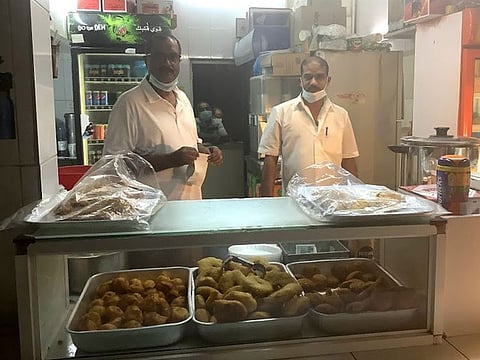 Moosa Mohammed (left) with one of his employees. 