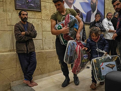 Syrian refugees, who have been forcibly evicted from the Lebanese northern town of Bsharre in the wake of a murder allegedly committed by a Syrian national, find refuge in the northern port city of Tripoli on November 26, 2020. - At least 270 Syrian families have left a north Lebanon town, as hostility towards them mounted over a murder allegedly committed by a Syrian national, the UN refugee agency said. Many of those who fled the Christian-majority town said they were chased out by Bsharre residents after a Syrian on Monday was accused of shooting dead a Lebanese resident, sparking widespread tension and hostility. 