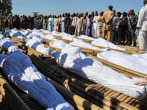 Mourners attend the funeral of 43 farm workers in Zabarmari, about 20km from Maiduguri, Nigeria, on November 29, 2020 after they were killed by Boko Haram fighters in rice fields near the village of Koshobe on November 28, 2020. 