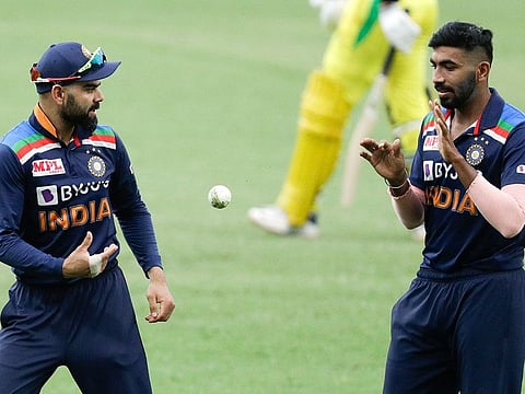 Virat Kohli's (left) decision to take Jasprit Bumrah off the attack after two overs during the second ODI in Sydney has raised quite a few eyebrows.