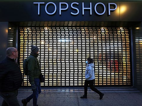 Pedestrians walk past a Topshop store, owed by Arcadia group on Oxford street in London, Britain, November 30, 2020.