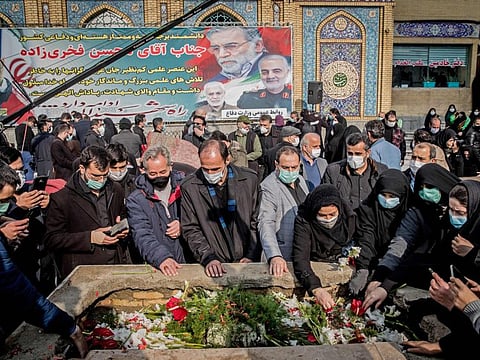 Iranian mourners attend the burial ceremony of slain nuclear scientist Mohsen Fakhrizadeh at Imamzadeh Saleh shrine in northern Tehran, on November 30, 2020. 