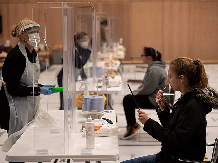 Swab test lateral flow students covid UK