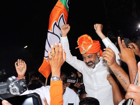 BJP Telangana President Bandi Sanjay along with supporters during GHMC election victory celebrations at BJP State Party office in Nampally in Hyderabad on Friday.  