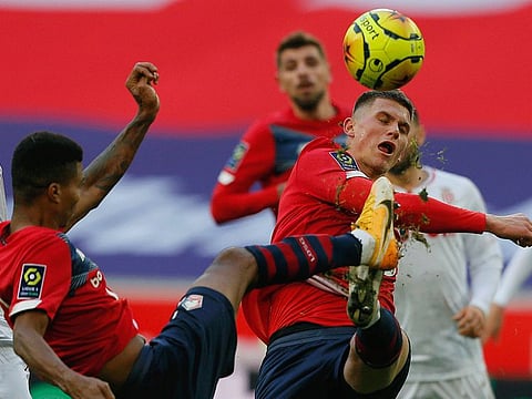 Lille's Sven Botman (right) in thick of action during the French League 1 match against Monaco at the Stade Pierre Mauroy stadium in northern France, Sunday. 