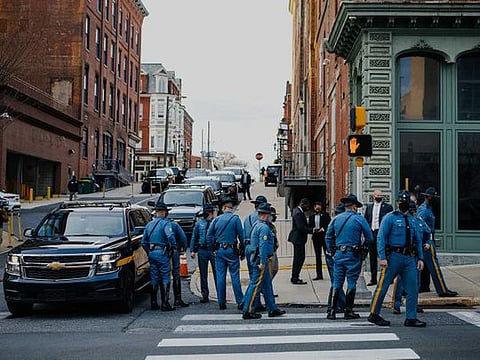 State troopers and Secret Service officers gather outside The Queen theatre as President-elect Joe Biden arrives in downtown Wilmington on Dec. 3, 2020. Joe Biden’s hometown, known chiefly for its dull, corporate vibe, has become the centre of the political universe and residents are thrilled. 