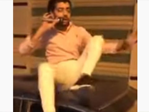 A video of a young man insulting a woman, allegedly his ex-fiancée, through a loudspeaker in a busy street has gone viral on social media. 