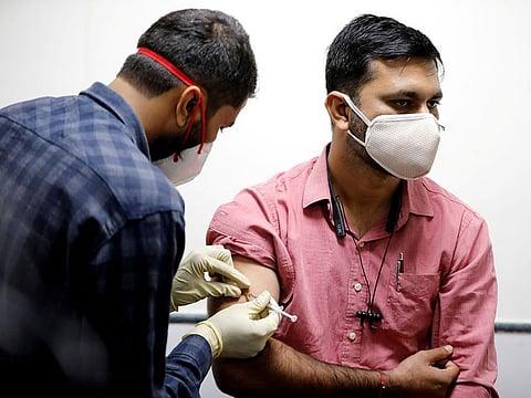 File photo: A medic administers Covaxin, an Indian government-backed experimental COVID-19 vaccine, to a health worker during its trials, at the Gujarat Medical Education & Research Society in Ahmedabad. 