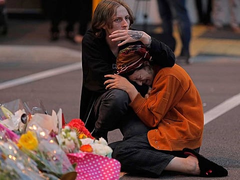 In this March 16, 2019, file photo, mourners pay their respects at a makeshift memorial near the Masjid Al Noor mosque in Christchurch, New Zealand.
