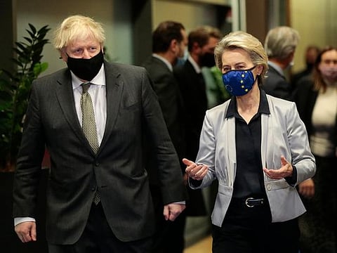 European Commission President Ursula von der Leyen, right, speaks with British Prime Minister Boris Johnson prior to a meeting at EU headquarters in Brussels, Wednesday, Dec. 9, 2020.