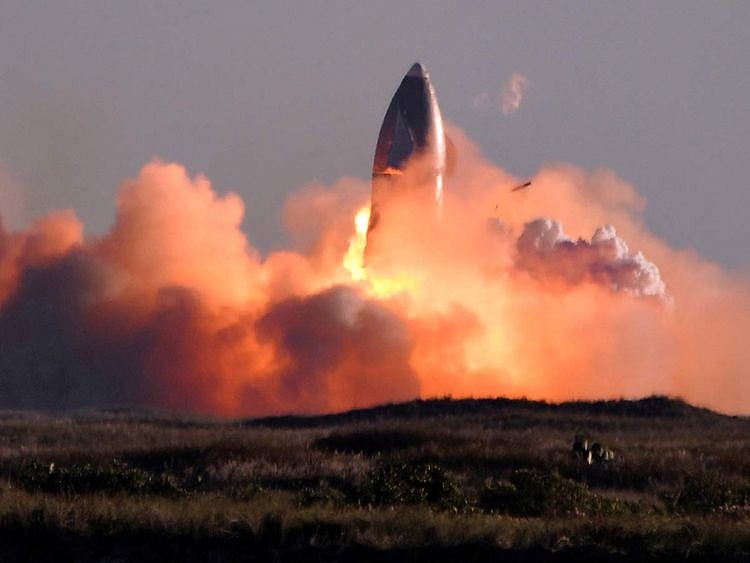 SpaceX's first super heavy-lift Starship SN8 rocket explodes during a return-landing attempt after it launched from their facility on a test flight in Boca Chica, Texas U.S. December 9, 2020.