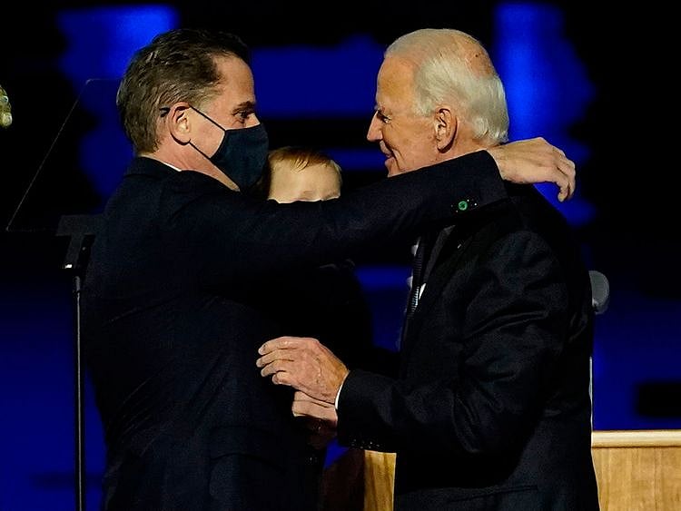 In this file photo taken on November 07, 2020 US President-elect Joe Biden (R) embraces his son Hunter Biden (L) on stage after delivering remarks in Wilmington, Delaware. - US President-elect Joe Biden's son Hunter, a frequent target of Republican attacks during the 2020 election campaign, said December 9, 2020, he is under investigation for potential tax violations.