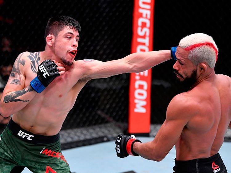 Brandon Moreno of Mexico and Deiveson Figueiredo fight during UFC 256 
