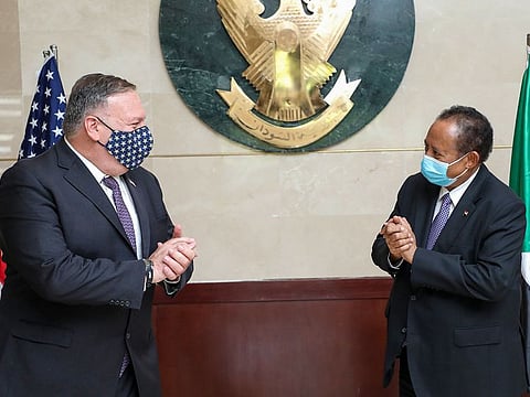 US Secretary of State Mike Pompeo (L) greets Sudanese Prime Minister Abdalla Hamdok (R) in Khartoum. - The United States on December 14, 2020 formally removed Sudan's state sponsor of terrorism designation, 27 years after putting the country on its blacklist, the US embassy in Khartoum announced. "The congressional notification period of 45 days has lapsed and the Secretary of State has signed a notification stating rescission of Sudan's State Sponsor of Terrorism designation is effective as of today (December 14), to be published in the Federal Register," the US embassy said on Facebook.