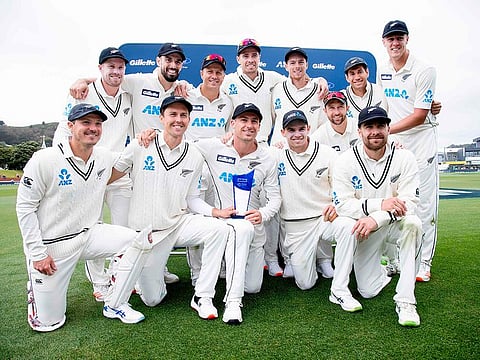 New Zealand cricket team pose as they celebrate after their series win during the fourth day of the second cricket Test match between New Zealand and the West Indies at the Basin Reserve in Wellington on December 14, 2020. 