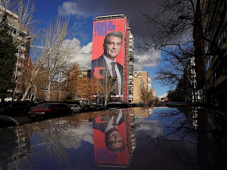 A giant electoral poster of Barcelona presidential hopeful Joan Laporta is seen on a building next to the Santiago Bernabeu Stadium in Madrid.