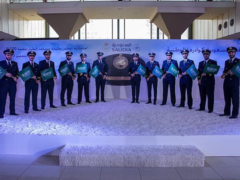 Saudi co-pilots pose for a group photo at a recent ceremony of the national carrier. 