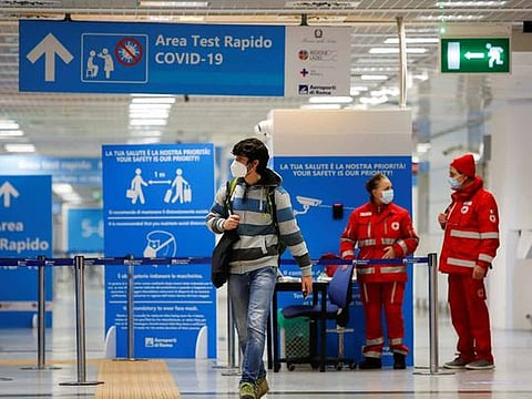 A passenger walks at Fiumicino airport amid the spread of the coronavirus disease (COVID-19), in Rome, Italy