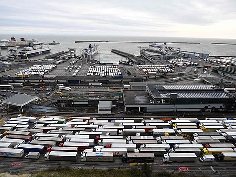 Freight lorries queue to enter the port of Dover on the south coast of England on December 18, 2020.