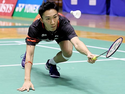 Japan's badminton world No. 1 Kento Momota competes in the first round of All-Japan National Championships in Tokyo on December 23,