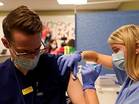 Fourth-year medical student Anna Roesler administers the Pfizer-BioNTech coronavirus disease (COVID-19) vaccine at Indiana University Health, Methodist Hospital in Indianapolis, Indiana, US, December 16, 2020. 