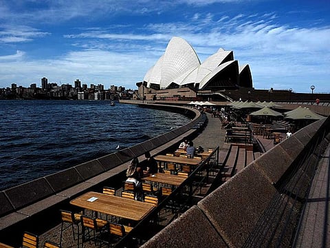 This general view shows seating for restaurants mostly empty along Sydney Harbour, usually packed with locals and tourists on Christmas Eve but now quiet due to COVID-19 coronavirus concerns, in Sydney on December 24, 2020. 