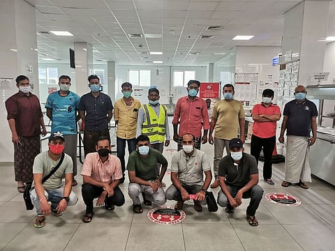 Some of the stranded passengers along with an ICF volunteer (centre in safety vest) at the free accommodation provided to them on Thursday 