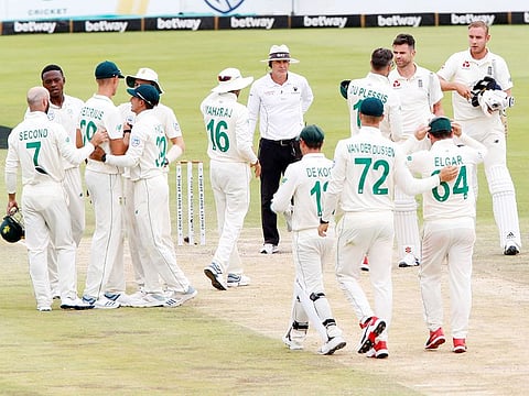 South Africa' Faf du Plessis with England's James Anderson and Stuart Broad as South Africa players celebrate winning the first test match at Supersport Park, Centurion. 