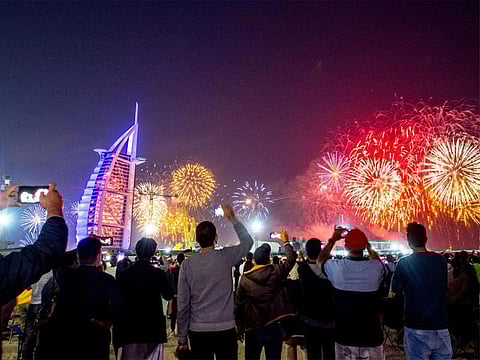 Fireworks at the Jumeirah public beach next to the Burj Al Arab waiting for the midnight new year fireworks.