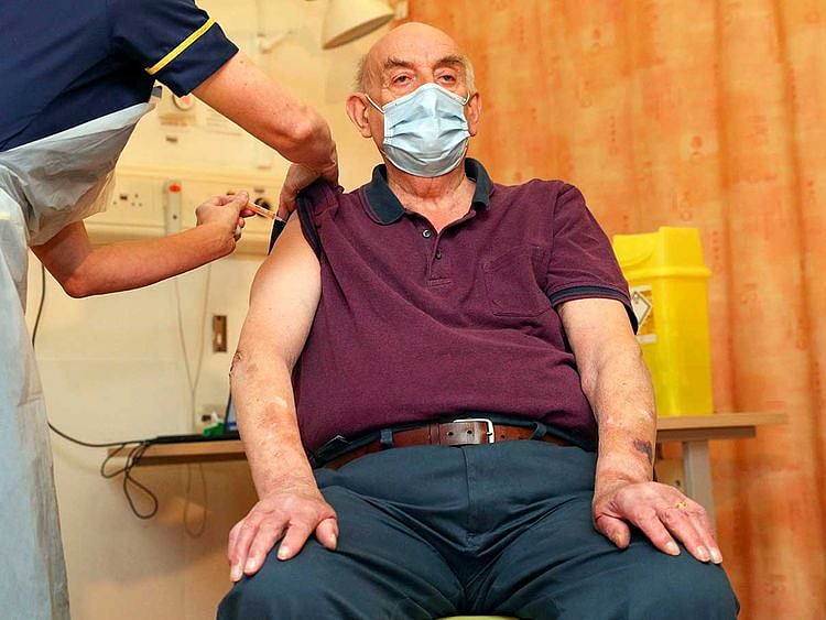 82-year-old Brian Pinker receives the Oxford University/AstraZeneca COVID-19 vaccine UK