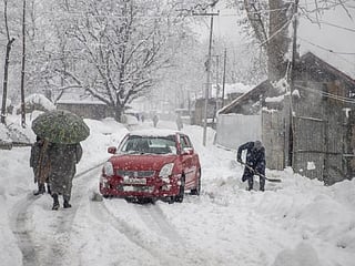 In pictures: Heavy snowfall disrupts life in Kashmir