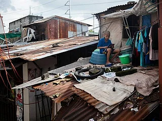 Scaling roofs and mountains, Philippine students battle to take online classes 