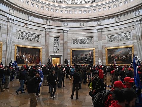 Supporters of US President Donald Trump enter the US Capitol's Rotunda on January 6, 2021, in Washington, DC.