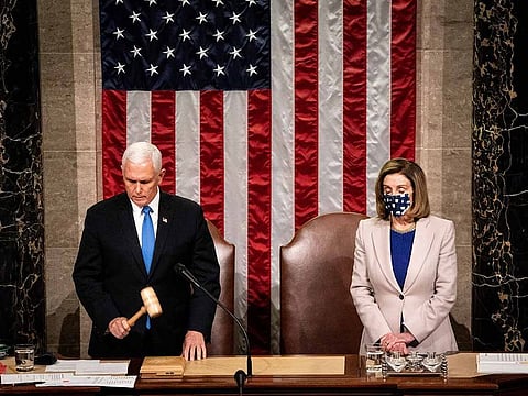 U.S. Vice President Mike Pence and U.S. House Speaker Nancy Pelosi, a Democrat from California, preside over a joint session of Congress to count the Electoral College votes of the 2020 presidential election in the House Chamber in Washington, D.C., U.S., on Wednesday, Jan. 6, 2021