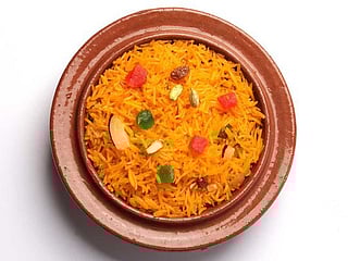 Zarda Pulao or sweet rice with orange and chicken 
