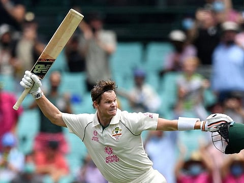 Australia's Steven Smith is ecstatic as he reaches a century during the second day of the third Test against India at the Sydney Cricket Ground on Friday.