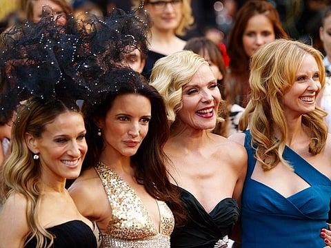 In this file photo taken on May 27, 2010, US actress Sarah Jessica-Parker, US actress Kristin Davis, English actress Kim Cattrall and US actress Cynthia Nixon pose as they arrive at the UK premiere of "Sex and the City 2" in Leicester Square, central London. A revival of the hit show "Sex and the City" stars all of its original leads except actress Kim Cattrall. The new series, titled "And Just Like That...",  features Sarah Jessica Parker, Cynthia Nixon and Kristin Davis
