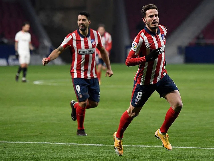 Atletico Madrid's Spanish midfielder Saul Niguez celebrates scoring his team's second goal during the Spanish League football match between Atletico Madrid and Sevilla at the Wanda Metropolitano stadium in Madrid.