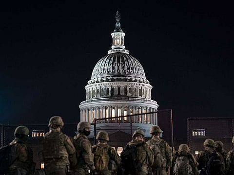 Members of the National Guard gather outside the US Capitol on January 12, 2021 in Washington, DC. 