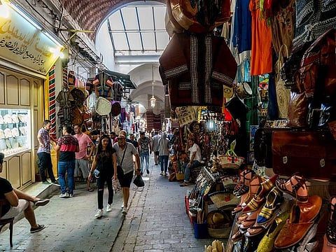 Shopping in the old medina of Tunis, Tunisia, Oct. 5, 2019. Tunisia will impose a temporary total lockdown in an effort to limit the spread of the novel coronavirus.