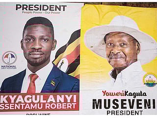 The posters of two most popular candidates for Uganda's Presidential election, incumbent President Yoweri Museveni (R) and Robert Kyagulanyi (L), aka Bobi Wine, the pop star-turned-opposition leader in Kampala, Uganda, on January 4, 2021. 