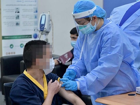 An inmate receives the COVID-19 vaccine.