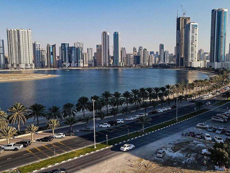 Stock Buhairah Corniche and Sharjah Skyline