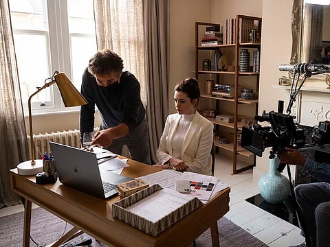 This image released by HBO Max shows director Doug Liman, left, with actress Anne Hathaway on the set of "Locked Down." In four months, in the middle of a pandemic and widespread shutdowns, Liman and his team wrote, shot and edited a glossy Harrods heist film in London with Hathaway and Chiwetel Ejiofor.
