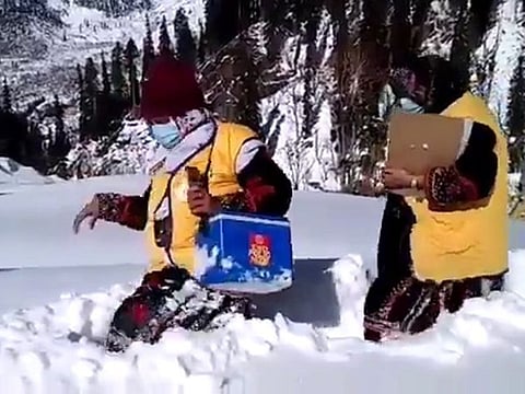 Pakistan's polio vaccinators brave the snow to deliver vaccines.